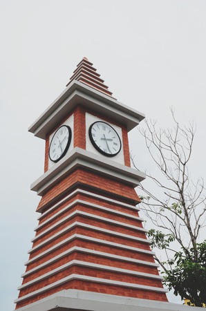 Vertical image old clock on the tower