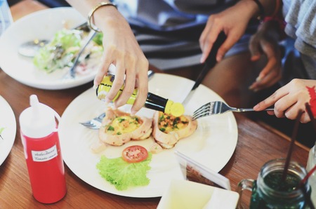 romantic breakfast , heart-shaped fried eggs with sausage with toastの写真素材