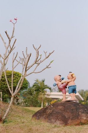 Thai boxing Child ceramic doll in gardenの写真素材