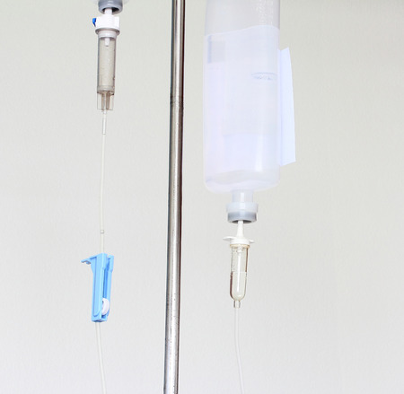 Infusion bottle with IV solution on white backgroundの写真素材