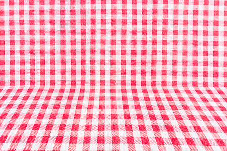 Red classic checkered tablecloth texture, background with copy spaceの写真素材