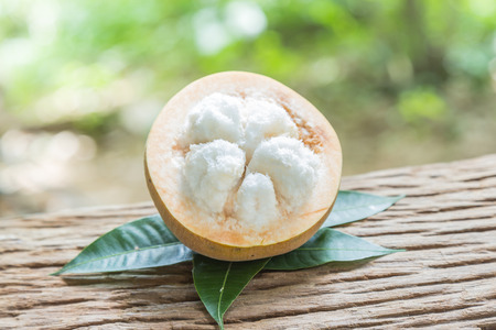 Santol fruit on wood