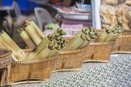 Glutinous rice roasted in bamboo joints famous Thai foodの写真素材
