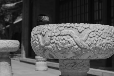 Large white marble pots with dragon patterns carved in Chinese gardensの写真素材