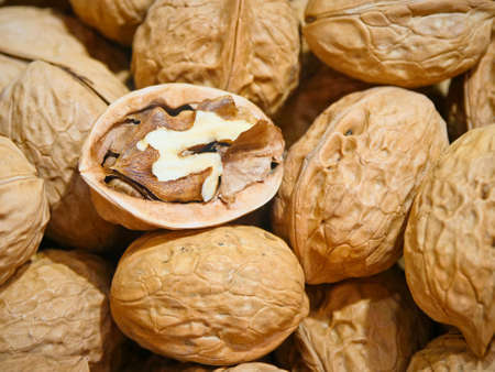 walnut and a cracked walnut closeup shot
