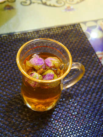 Rose flower tea in glass cup, black teaの写真素材