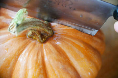 Round pumpkin in the kitchen, Golden, texture detailsの写真素材