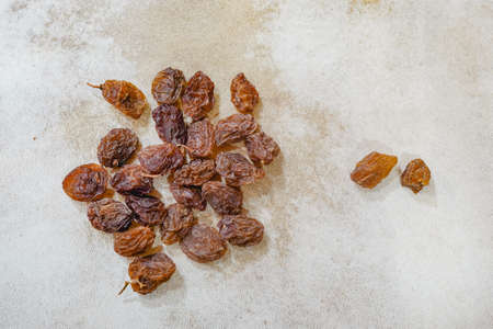Bunch of red raisins, fresh grapes and sun-dried snacksの写真素材