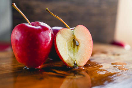 Indoor red small apple cut, beautiful fresh juicy fruitの写真素材