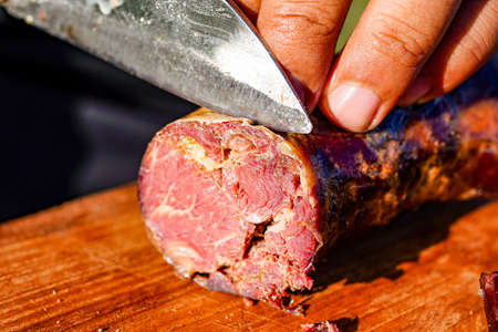 Horse meat and sausage cooked on the prairieの写真素材