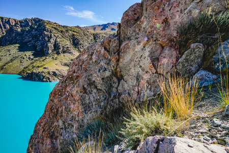 The scenery of the blue lake surrounded by mountainsの写真素材