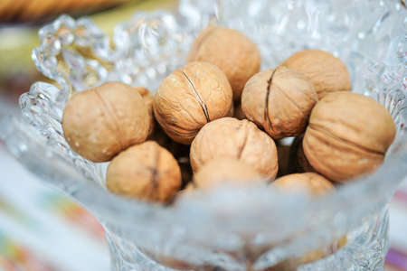 Walnut nuts in glass bowlの写真素材