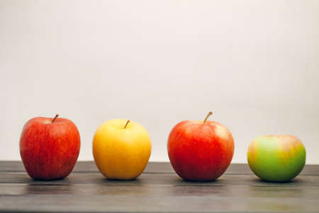 Fruit apples in a row on the tableの写真素材