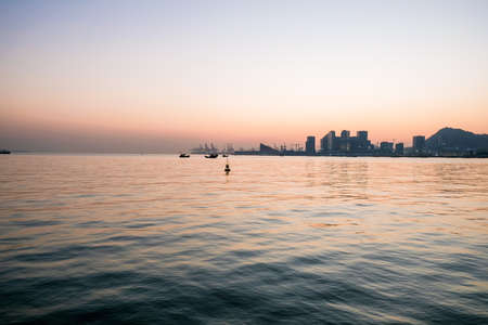 Silhouette of boat pier before sunsetの写真素材