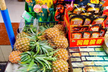 Fresh pineapples on the fruit standの写真素材