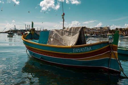 colorful old canoes used for fishingの写真素材