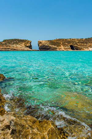 rocky beach with blue water