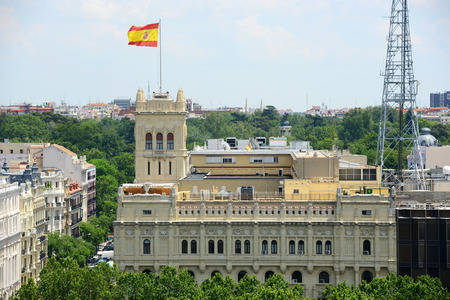 Spanish National Flag on top of the Ministry of Defence of Spain, Madrid, Spainの写真素材