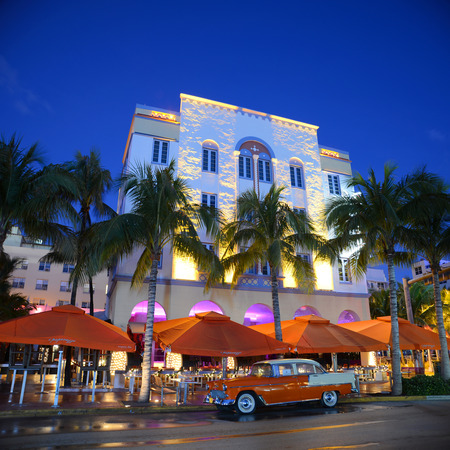 Edison Hotel with Art Deco Style Building and antique Chevrolet Bel Air in Miami Beach at night, Miami, Florida, USA. Edison Hotel on Ocean Drive is Art Deco with Mediterranean Revivalism style, is one of the most famous architecture in South Beach.のeditorial素材