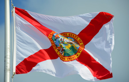 Flag of State of Florida in blue sky backgroundの写真素材