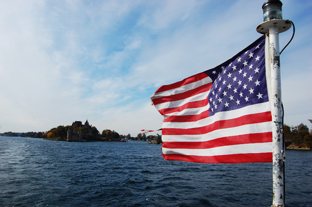 USA National Flag on St. Lawrence River in Thousand Islands, New York, USA.の写真素材