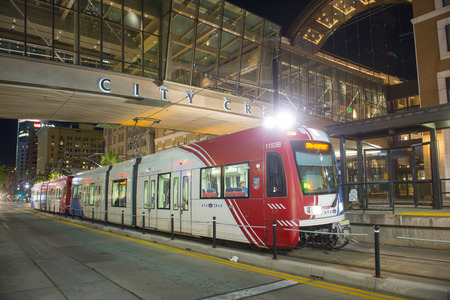UTA Light Rail Siemens S70 Blue Line at City Center Station at night in downtown Salt Lake City, Utah, USA.のeditorial素材