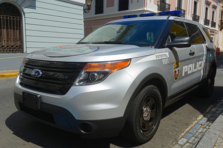 San Juan Police Car on Plaza de Armas in Old San Juan, Puerto Rico.のeditorial素材