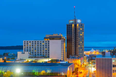 Anchorage downtown aerial view including Hilton Anchorage Hotel building at night in downtown Anchorage, Alaska, AK, USA.のeditorial素材