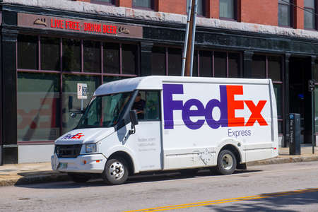 FedEx truck on Elm Street in downtown Manchester, New Hampshire NH, USA.のeditorial素材