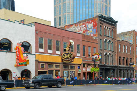 Bars on historical Broadway in downtown Nashville, Tennessee, USA. Lower Broadway is famous for entertainment district of country music.のeditorial素材