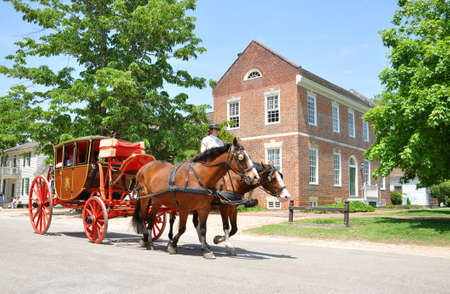 Horse drawn carriage tours in British Colony in Williamsburg, Virginia VA, USA.