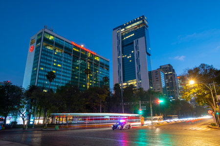 Modern skyscraper buildings including Sheraton and Sofitel at night on Avenida Paseo de la Reforma Avenue at Angel of Independence monument, Mexico City CDMX, Mexico.のeditorial素材
