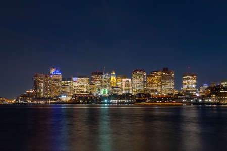 Boston City Skyscrapers, Custom House and Boston Waterfront at night from East Boston, Boston, Massachusetts MA, USA.の写真素材