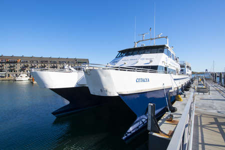 MBTA catamaran boat Cetacea docked at Long Wharf in Boston Harbor, city center of Boston,...