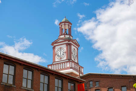 Historic Assabet Woolen Mill, built in 1847, on Main Street on Assabet River in Maynard historic town center in spring, Maynard, Massachusetts MA, USA.の写真素材