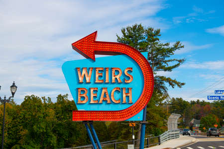 Entrance sign of Weirs Beach with neon lights in village of Weirs Beach in City of Laconia, New Hampshire, USA.のeditorial素材