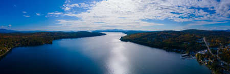 Panoramic aerial view of Meredith Bay in Lake Winnipesaukee in fall from town center of Meredith, New Hampshire NH, USA.の写真素材