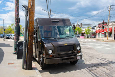 UPS United Parcel Service delivery truck in village of Newton Centre, Newton, Massachusetts MA, USA.のeditorial素材