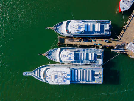 Top view of Whale watch ship docked at Town Wharf at historic town center of Plymouth, Massachusetts MA, USA.の写真素材