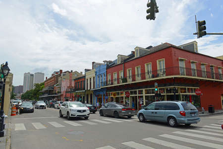 Historic commercial buildings on Decatur Street at Dumaine Street in French Quarter in New Orleans, Louisiana LA, USA.のeditorial素材