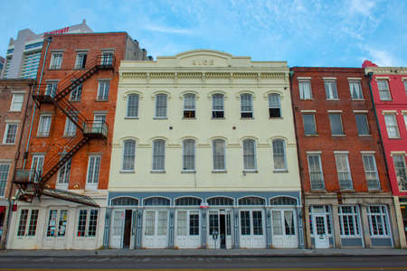 Historic commercial buildings at 233 N Peters Street between Bienville Street and Iberville Street in French Quarter in New Orleans, Louisiana LA, USA.のeditorial素材