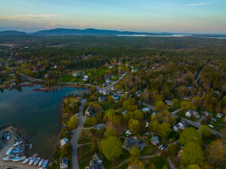Bass Harbor and village aerial view at sunset with Mountains in Acadia National Park at the background in town of Tremont on Mt Desert Island, Maine ME, USA.の写真素材