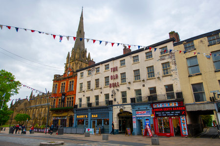 Old Bull historic building at 141 Church Street and Preston Minster church in historic city centre of Preston, Lancashire, UK.のeditorial素材