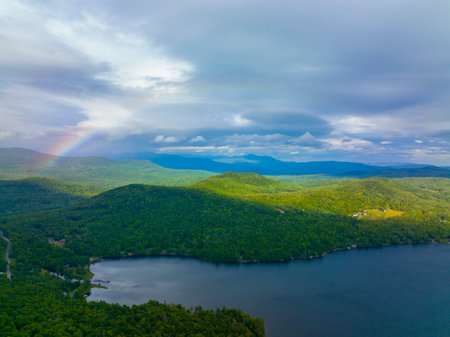Aerial view of Rainbow over Stinson Lake in White Mountain National Forest in summer in town of Rumney, Grafton County, New Hampshire NH, USA.の写真素材