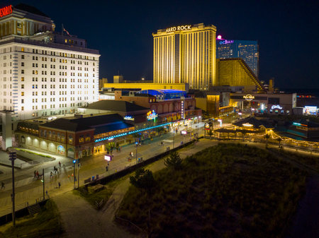 Hard Rock Hotel, Showboat and Ocean Casino Resort at Boardwalk at night in Atlantic City, New Jersey NJ, USA.のeditorial素材