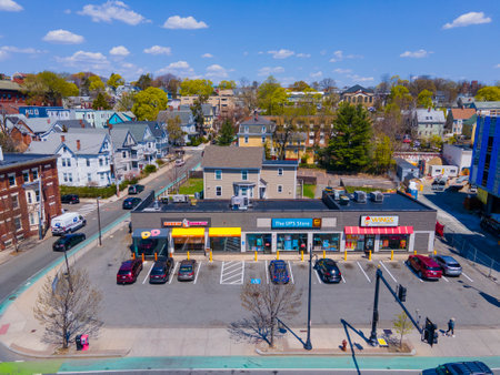 Dunkin' and UPS Store aerial view at 519 Somerville Avenue at Central Street in spring, city of Somerville, Massachusetts MA, USA.のeditorial素材