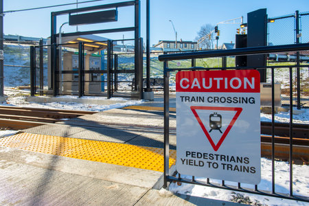 MBTA Green Line Caution Sign at Ball Square station in Medford and Somerville, Massachusetts MA, USA. The station is Green Line Extension opened on Dec. 12, 2022.のeditorial素材