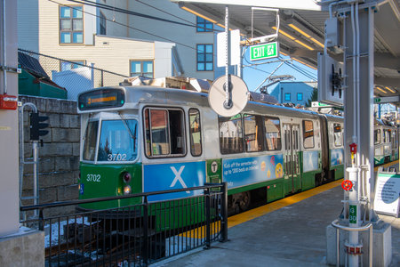 MBTA Green Line Kinki Sharyo Type 7 train at Magoun Square station in Somerville, Massachusetts MA, USA. Green Line Extension opened in Dec. 12, 2022.のeditorial素材
