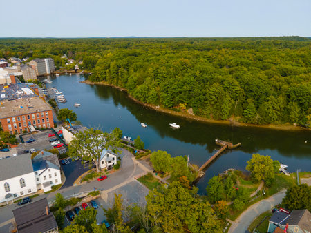Newmarket Mills building aerial view on Lamprey River on Main Street in historic town center of Newmarket, New Hampshire NH, USA. Now this building is Rivermoor Landing Apartment.の写真素材