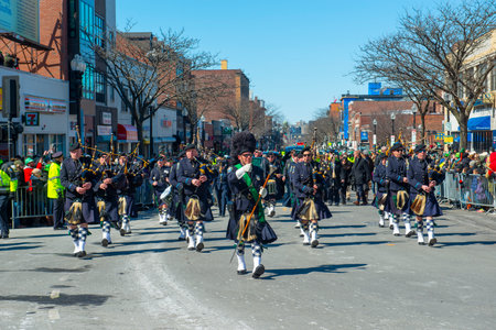 Scottish bagpiper band with Highland kilt dress on 2018 Saint Patrick's Day Parade in Boston, Massachusetts MA, USA.のeditorial素材